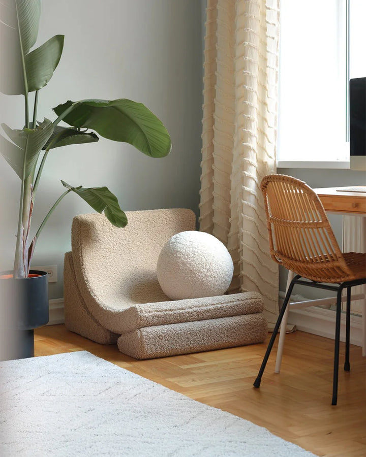 Wigiwama Biscuit Moon Chair in a cosy home interior