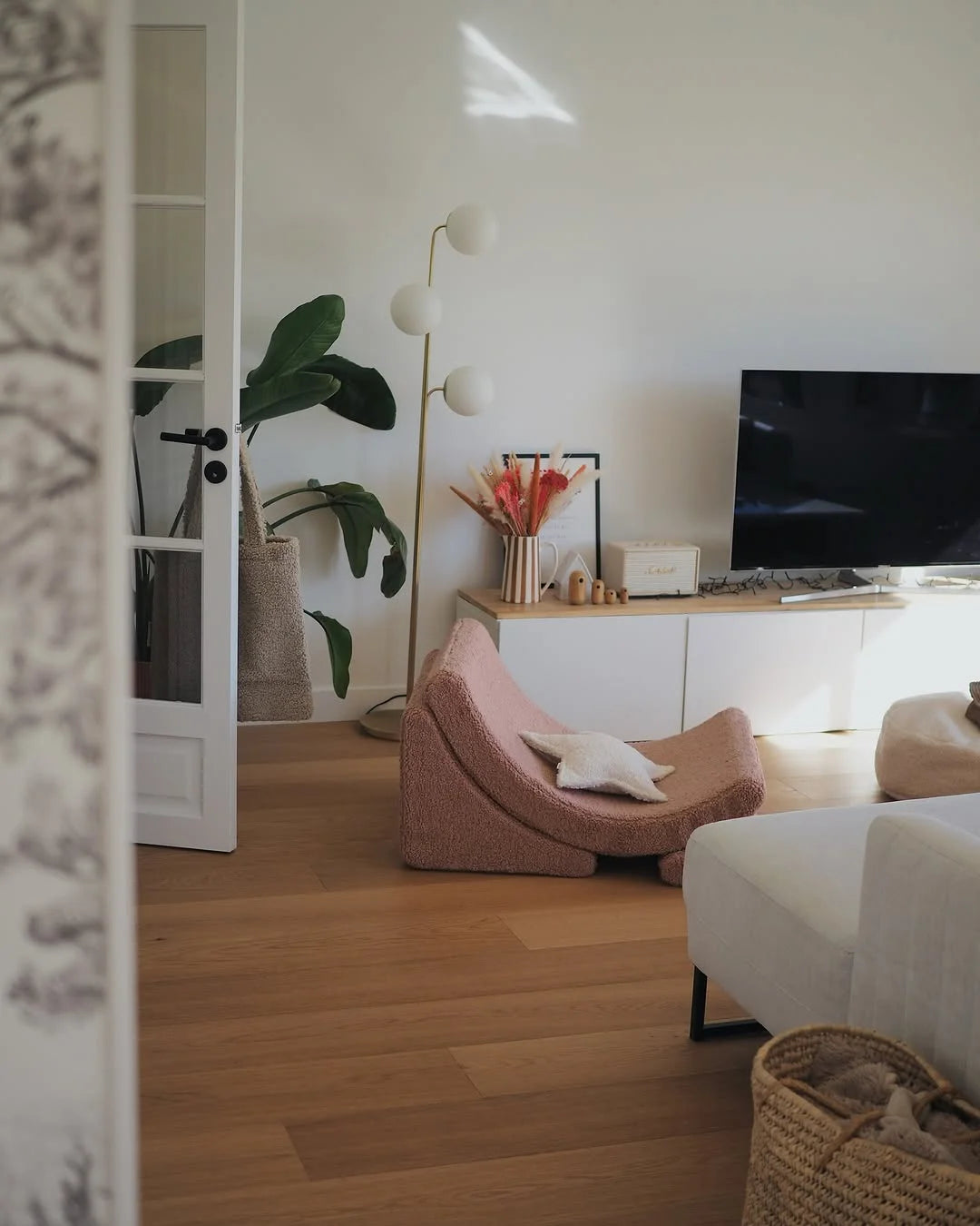 Guava Moon Chair adding warmth and softness to a kids’ play corner in a Scandinavian-inspired interior