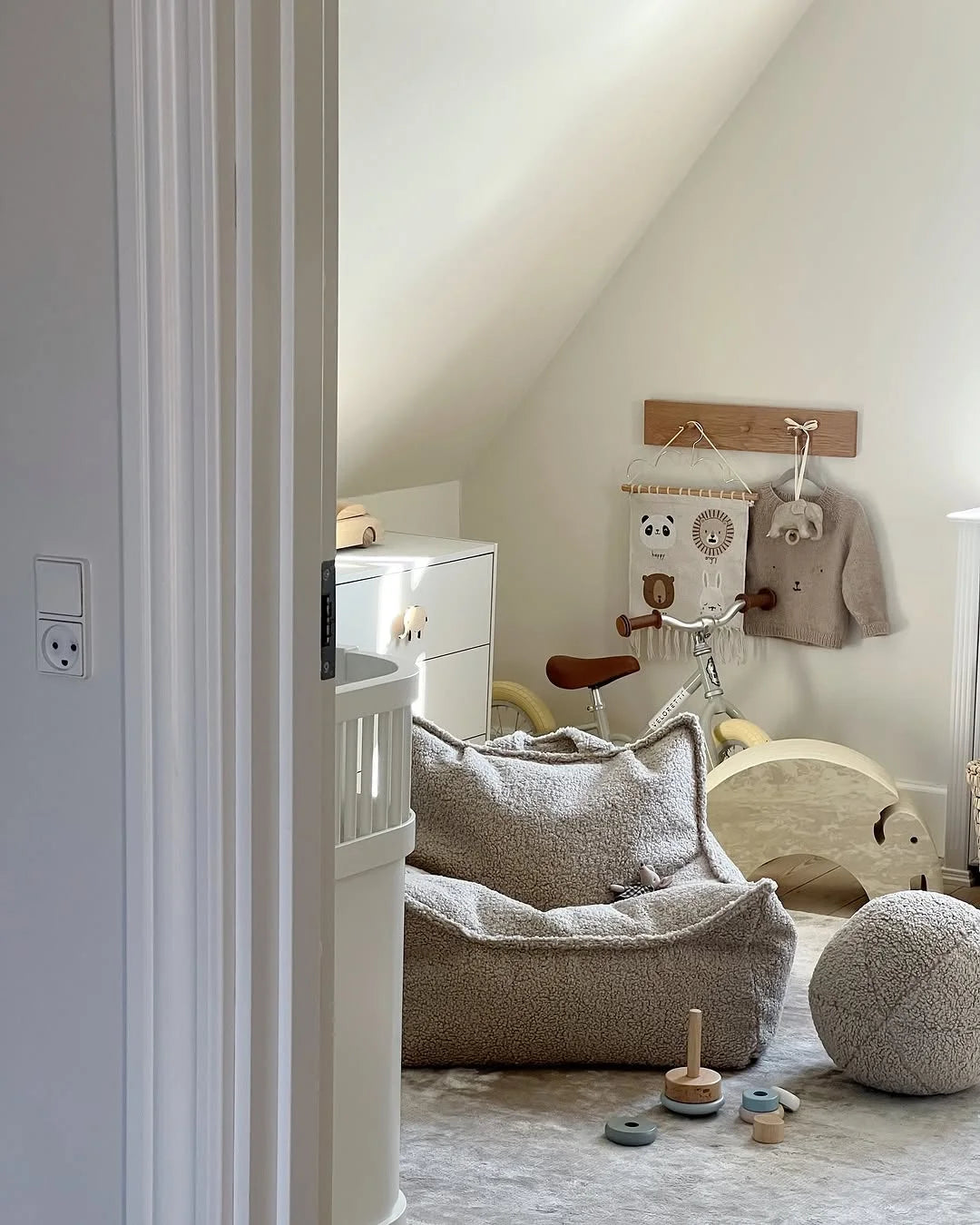 Minimal Scandinavian kids room with Wigiwama soft teddy furniture, wooden toys, and a neutral colour palette