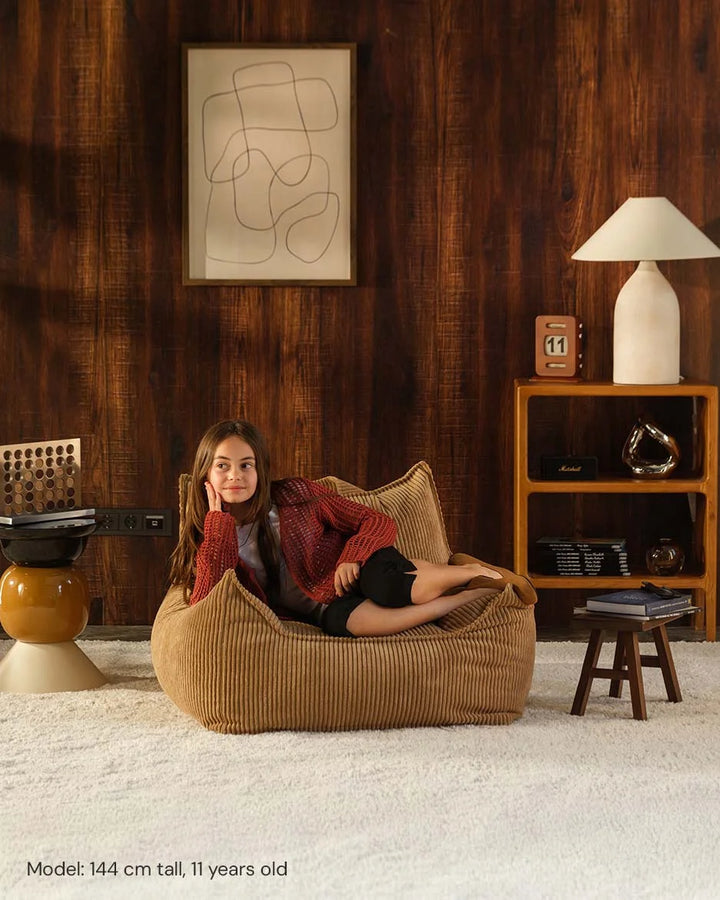Wigiwama Toffee Club Chair in a cosy home interior