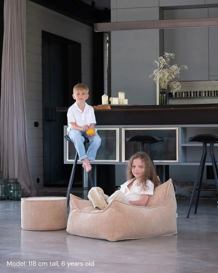 Children playing on Wigiwama Brown Sugar Beanbag Chair in a cosy home interior