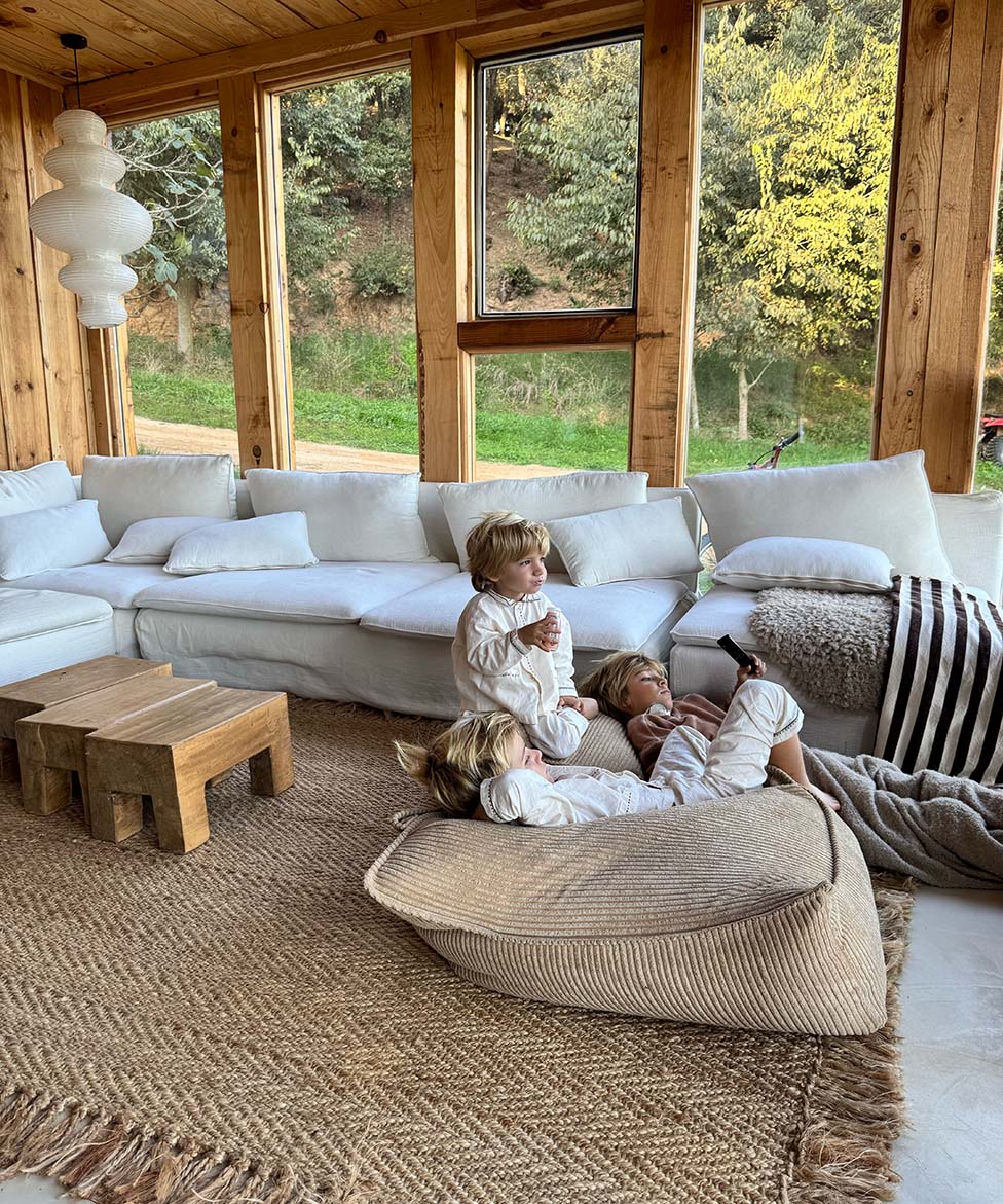 Three boys lounging on Wigiwama Brown Sugar Beanbag Chair in summerhouse