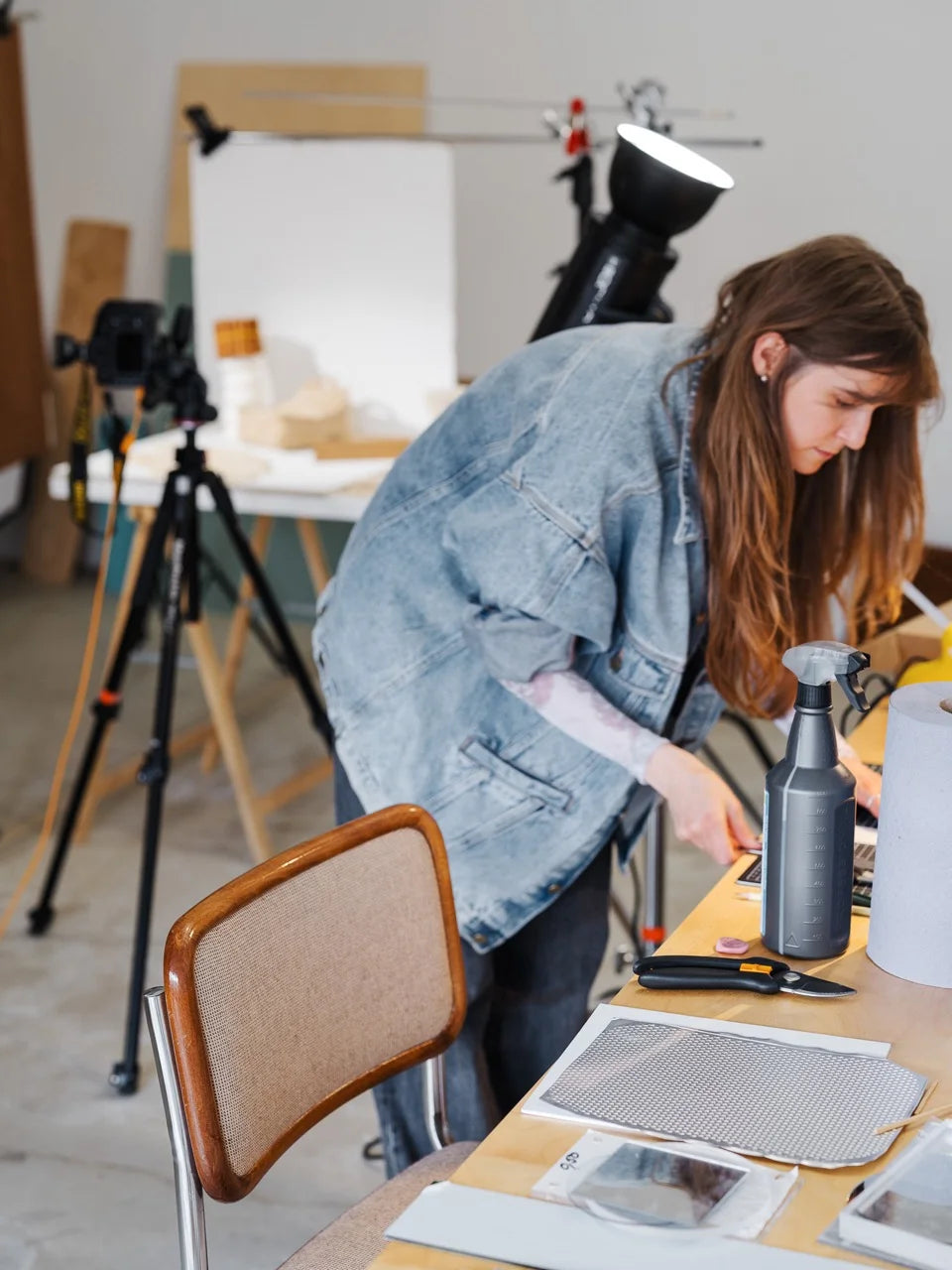 Zane Priede styling ingredients and materials on her work table, preparing elements for the Mini Beanbag photoshoot.